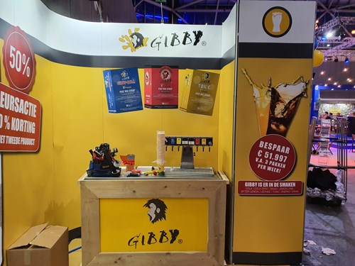 Gibby booth at a Dutch trade fair, tasting counter and product range